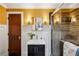 Bright bathroom with a glass-enclosed shower, modern vanity, and stylish sconce lighting at 1666 Johnson Ne Rd, Atlanta, GA 30306