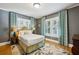 Cozy bedroom with hardwood floors, neutral walls, and large windows offering plenty of natural light at 1666 Johnson Ne Rd, Atlanta, GA 30306