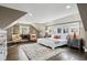 Bright primary bedroom with hardwood floors, large windows, and comfortable seating area with desk at 1666 Johnson Ne Rd, Atlanta, GA 30306