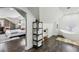 Cozy bedroom and bathroom featuring wood floors and a freestanding tub at 1666 Johnson Ne Rd, Atlanta, GA 30306