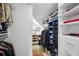 Walk-in closet featuring built-in shelving and hanging racks for ample storage at 1666 Johnson Ne Rd, Atlanta, GA 30306