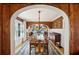 Elegant dining room with a long table, archway view, and hardwood floors at 1666 Johnson Ne Rd, Atlanta, GA 30306