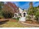 Charming home with stone chimney, brick walkway, and fresh landscaping at 1666 Johnson Ne Rd, Atlanta, GA 30306