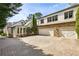 Large three-car garage with stone accents and circular brick driveway at 1666 Johnson Ne Rd, Atlanta, GA 30306