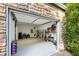 Spacious three-car garage with overhead door and white painted walls with ample space for storage and organization at 1666 Johnson Ne Rd, Atlanta, GA 30306