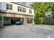 Spacious three-car garage with brick driveway and basketball hoop at 1666 Johnson Ne Rd, Atlanta, GA 30306