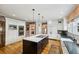 Wide kitchen shot features an island, stainless appliances, and hardwood floors at 1666 Johnson Ne Rd, Atlanta, GA 30306
