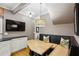 Eat-in kitchen nook featuring a TV, built-in bench seating, and hardwood floors at 1666 Johnson Ne Rd, Atlanta, GA 30306