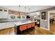 Bright kitchen with white cabinets, a central island, and a cozy breakfast nook at 1666 Johnson Ne Rd, Atlanta, GA 30306