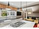 Modern kitchen with white backsplash, stainless steel appliances, island cooktop and breakfast nook at 1666 Johnson Ne Rd, Atlanta, GA 30306