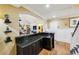 Open concept living area featuring a bar counter, hardwood floors, and modern design at 1666 Johnson Ne Rd, Atlanta, GA 30306