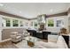 Stylish outdoor kitchen featuring black cabinets, stainless steel appliances, and ample seating at 1666 Johnson Ne Rd, Atlanta, GA 30306