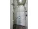 Walk-in shower featuring glass doors, subway tile walls, and a rainfall shower head at 1666 Johnson Ne Rd, Atlanta, GA 30306