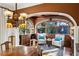 Cozy sitting area with stone arches and ample windows featuring seating and dark wood built-ins at 1666 Johnson Ne Rd, Atlanta, GA 30306