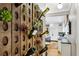 Unique wine rack display adds character to the hallway leading to the modern kitchen at 1666 Johnson Ne Rd, Atlanta, GA 30306