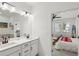 Bathroom featuring double sink vanity and modern finishes, open to bedroom at 4414 Declan Dr, Kennesaw, GA 30144