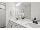 Bright bathroom featuring double sink vanity, modern fixtures, and a large mirror at 4414 Declan Dr, Kennesaw, GA 30144