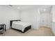 This bedroom has neutral carpet and black trim, creating a minimalist modern look at 4414 Declan Dr, Kennesaw, GA 30144