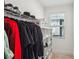 Bright walk-in closet with built-in shelving and ample storage space at 4414 Declan Dr, Kennesaw, GA 30144