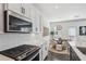 Updated kitchen with stainless steel appliances, subway tile backsplash and sleek countertops at 4414 Declan Dr, Kennesaw, GA 30144