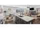 Spacious kitchen with island seating, stainless appliances, and open floor plan at 4414 Declan Dr, Kennesaw, GA 30144