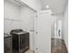 Convenient laundry room features sleek, modern appliances and additional storage space at 4414 Declan Dr, Kennesaw, GA 30144