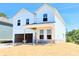 Two-story new construction featuring white siding, and an attached garage with covered parking at 650 Redhead Way (Lot 25), Grayson, GA 30017