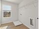 Laundry room featuring wood floors, a window, and laundry hookups at 650 Redhead Way (Lot 25), Grayson, GA 30017