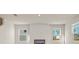 Bright living room with a modern fireplace and ample windows that fill the space with natural light at 650 Redhead Way (Lot 25), Grayson, GA 30017