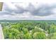 Enjoy breathtaking views from this balcony overlooking a canopy of lush trees and city skyline at 1501 Clairmont Rd # 2016, Decatur, GA 30033