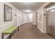 Well-lit hallway featuring neutral tones, carpeted floors, and an elevator for easy access to different floors at 1501 Clairmont Rd # 2016, Decatur, GA 30033