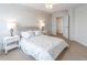 Cozy main bedroom featuring a ceiling fan, neutral decor, and an ensuite bathroom at 1501 Clairmont Rd # 2016, Decatur, GA 30033