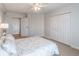 Neutral main bedroom offering a spacious closet, ceiling fan, and an ensuite bathroom at 1501 Clairmont Rd # 2016, Decatur, GA 30033