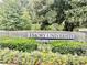 The Emory University sign is surrounded by colorful flowers and lush greenery, creating an inviting and attractive entrance at 1501 Clairmont Rd # 2016, Decatur, GA 30033