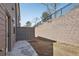 Backyard features a privacy fence, small patio and retaining wall at 1696 Gunnin Nw Trce # 244, Atlanta, GA 30318