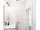 Clean bathroom features a white vanity, sink, mirror and modern lighting at 1696 Gunnin Nw Trce # 244, Atlanta, GA 30318