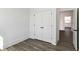 This bedroom offers base trim and a white closet door at 1696 Gunnin Nw Trce # 244, Atlanta, GA 30318