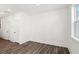 Neutral-toned bedroom with two closets, hardwood flooring and a window for natural light at 1696 Gunnin Nw Trce # 244, Atlanta, GA 30318