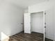 Bedroom features a white door leading to the closet with a clothing rod at 1696 Gunnin Nw Trce # 244, Atlanta, GA 30318