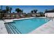 Community pool with lounge chairs and umbrellas by the townhomes at 1696 Gunnin Nw Trce # 244, Atlanta, GA 30318