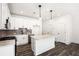 Contemporary kitchen featuring white cabinetry, a center island with a granite countertop, and modern lighting at 1696 Gunnin Nw Trce # 244, Atlanta, GA 30318