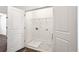 Laundry room features white walls, marble floor, and open bi-fold doors at 1696 Gunnin Nw Trce # 244, Atlanta, GA 30318