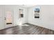 Well-lit living room featuring hardwood floors, two windows and a glass door at 1696 Gunnin Nw Trce # 244, Atlanta, GA 30318