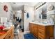 Spacious bathroom features a double vanity with wood cabinets at 410 Bowen Ne Rd, White, GA 30184