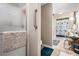 Bright bathroom features a glass-door shower and tiled floors at 410 Bowen Ne Rd, White, GA 30184