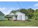 Charming single-story home with a welcoming front porch and well-maintained lawn at 410 Bowen Ne Rd, White, GA 30184