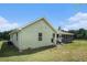 Home's backyard features screened in porch, fenced yard and well maintained lawn at 410 Bowen Ne Rd, White, GA 30184