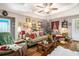 Inviting living room featuring hardwood floors, comfortable seating, and elegant decor at 410 Bowen Ne Rd, White, GA 30184