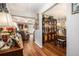 Inviting living room showcases wood floors and comfortable seating with a view of dining area at 410 Bowen Ne Rd, White, GA 30184