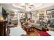 Spacious living room with hardwood floors, comfortable seating, and ample natural light at 410 Bowen Ne Rd, White, GA 30184